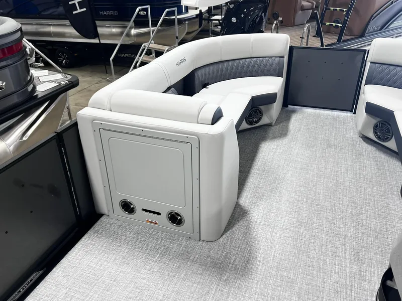 Slide: The Image of 2024 Harris Sunliner 230 boat interior with gray seating and carpet. - 11