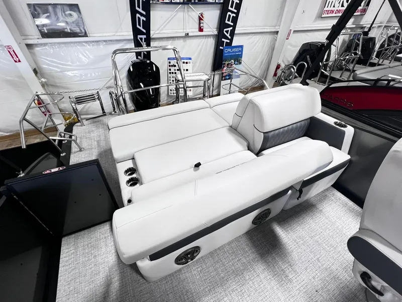 Slide: The Image of 2024 Harris Sunliner 230 boat interior with white seating and modern design. - 16