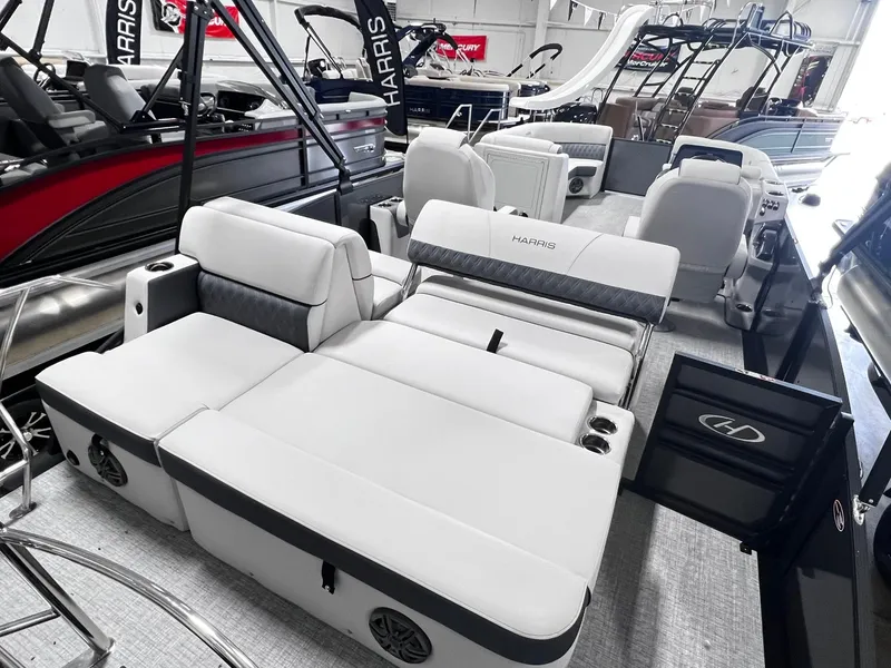 Slide: The Image of 2024 Harris Sunliner 230 pontoon boat interior with luxurious seating. - 17