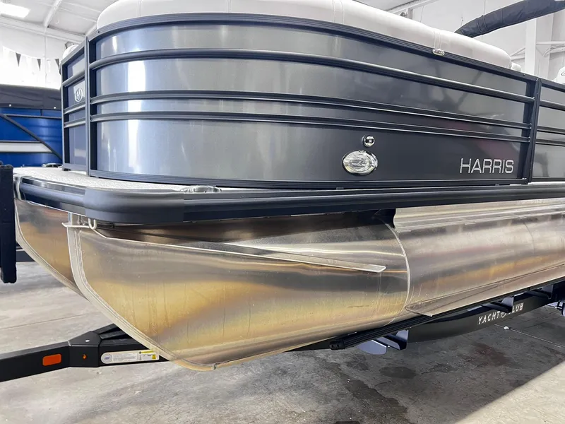 Slide: The Image of 2024 Harris Sunliner 230 pontoon boat in showroom. - 32