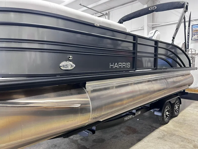 Slide: The Image of 2024 Harris Sunliner 230 pontoon boat in showroom. - 33