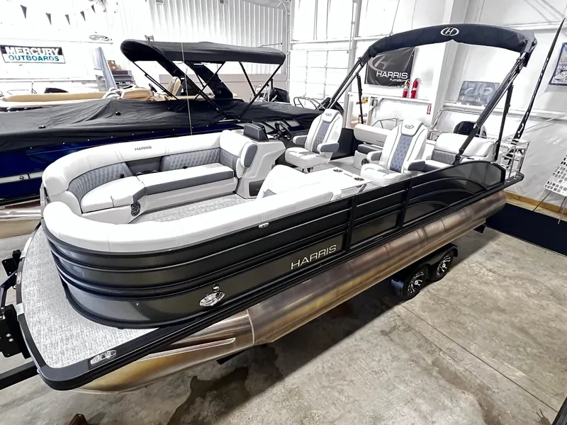 Slide: The Image of 2024 Harris Sunliner 230 pontoon boat in showroom. - 5