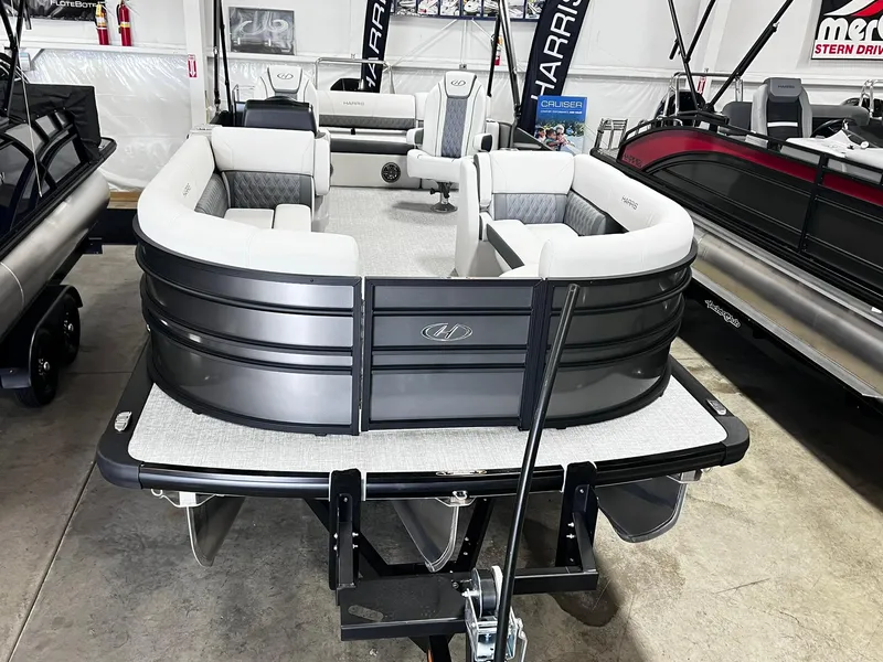 Slide: The Image of 2024 Harris Sunliner 230 pontoon boat in showroom. - 7