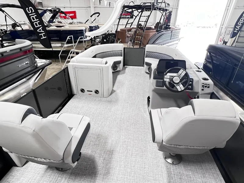 Slide: The Image of 2024 Harris Sunliner 230 pontoon boat interior with modern seating and helm. - 8