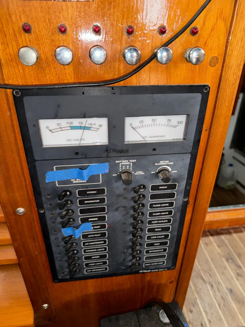 Slide: The Image of Control panel of a 1947 Rhodes Nevins Picnic Boat with gauges and switches. - 16
