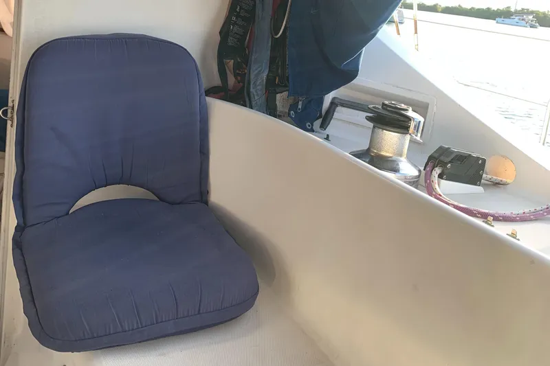 Slide: The Image of Blue cushioned seat on 1993 Lagoon TPI 42 sailboat deck. - 11
