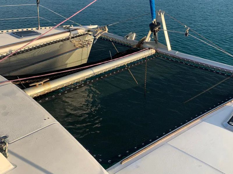 Slide: The Image of Lagoon TPI 42 catamaran netting over water, 1993 model. - 12