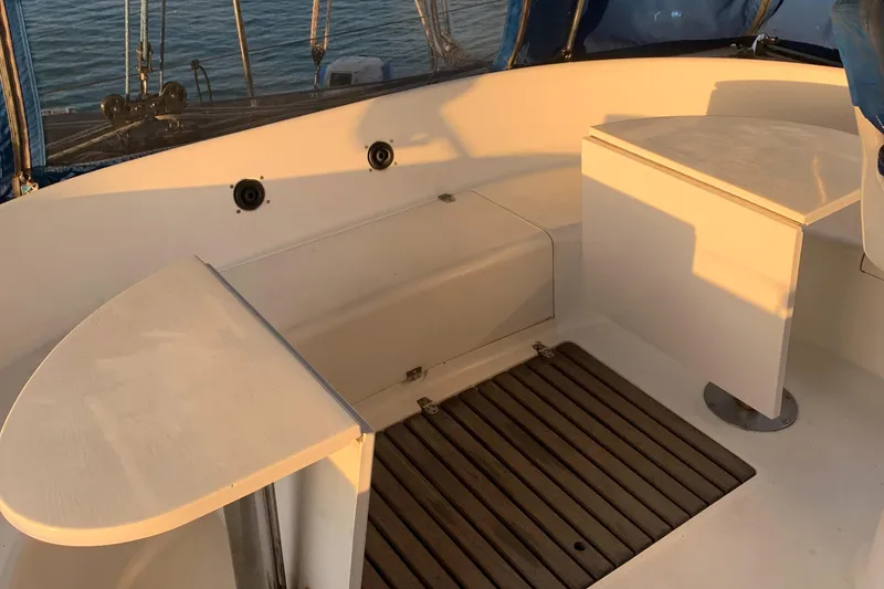 Slide: The Image of Lagoon TPI 42 sailboat cockpit, 1993 model, with wooden flooring and seating area. - 9