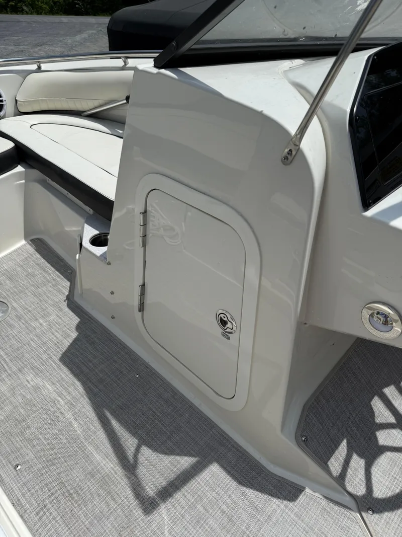 Slide: The Image of 2024 Stingray 201DC boat interior with seating and storage compartment. - 20
