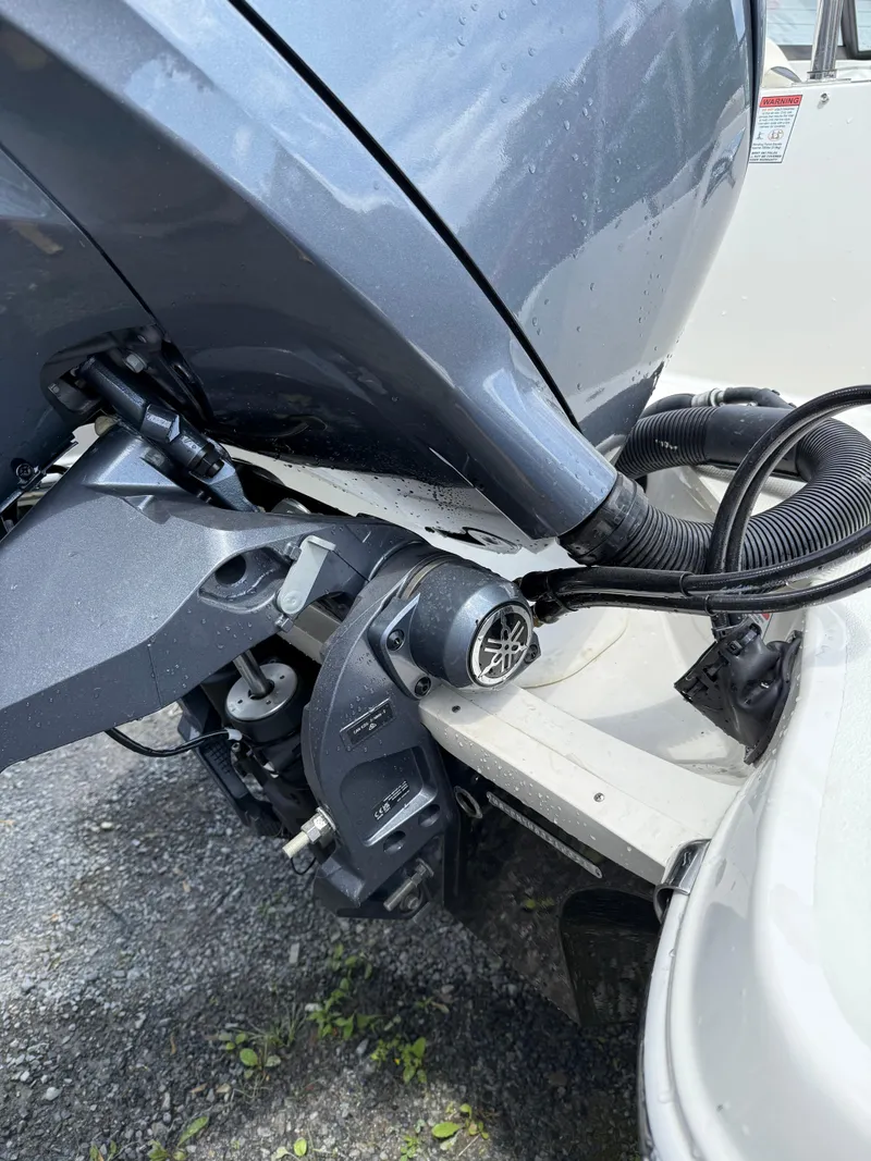 Slide: The Image of 2024 Stingray 201DC boat engine close-up, showcasing mechanical components and wiring. - 4