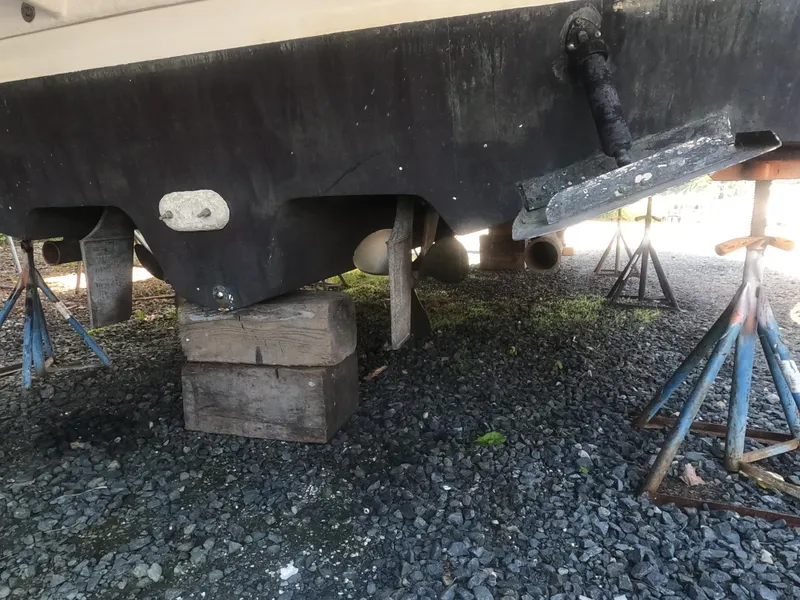 Slide: The Image of 2001 Sea Ray 340 Sundancer boat hull on stands for maintenance. - 15