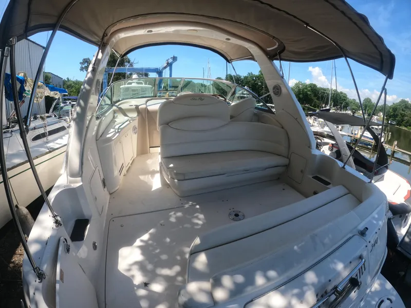 Slide: The Image of 2001 Sea Ray 340 Sundancer boat interior with seating and canopy. - 5