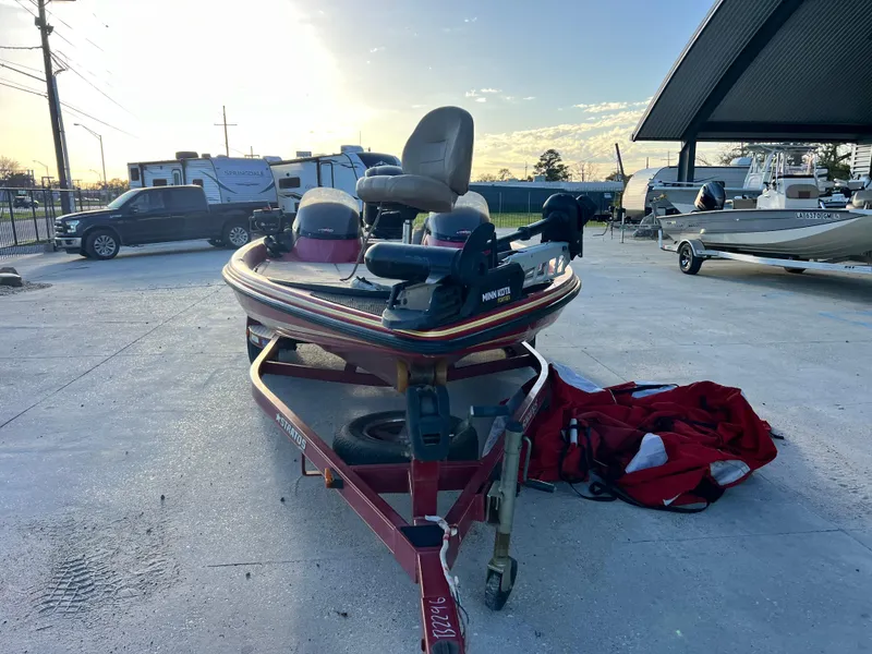 Slide: The Image of 2004 Stratos 201 Pro XL boat on trailer, parked outdoors with clear sky. - 3