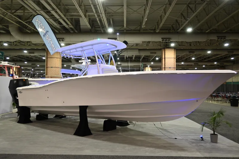 Slide: The Image of 2025 Jersey Cape 31 Little Devil boat on display at an indoor exhibition. - 1