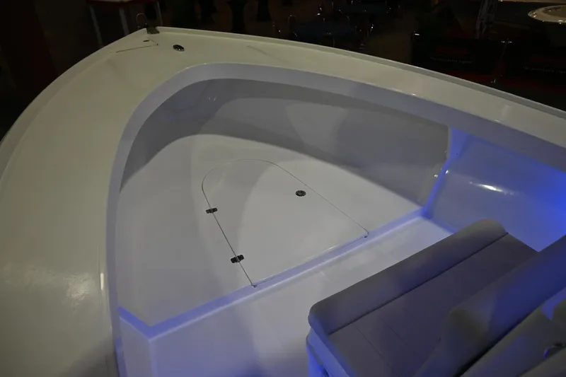 Slide: The Image of Interior view of 2025 Jersey Cape 31 Little Devil boat, featuring spacious seating and storage. - 11