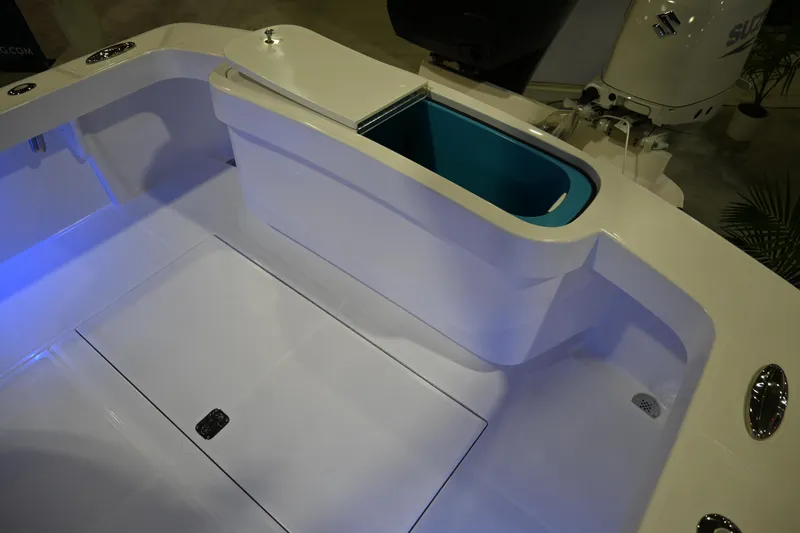 Slide: The Image of 2025 Jersey Cape 31 Little Devil boat interior with storage compartment. - 9