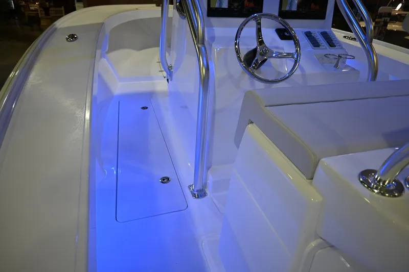 Slide: The Image of 2025 Jersey Cape 31 Little Devil boat interior with blue LED lighting. - 10