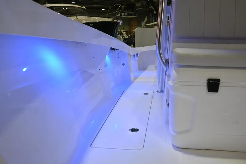 Slide: The Image of 2025 Jersey Cape 31 Little Devil boat interior with blue LED lighting. - 14