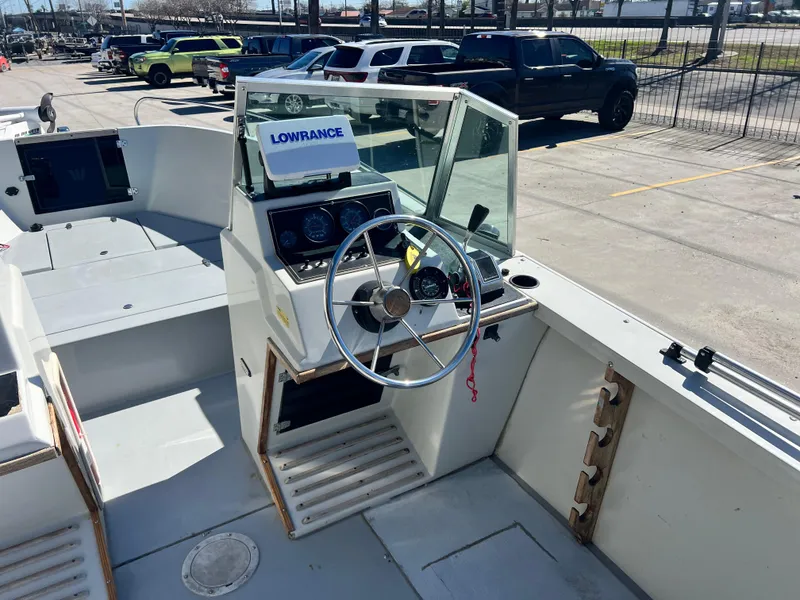 Slide: The Image of Interior view of a 1986 Wellcraft V-20 Sport boat with helm. - 14