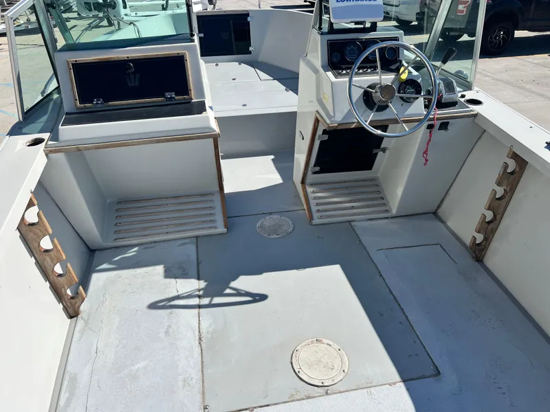 Slide: The Image of Interior of a 1986 Wellcraft V-20 Sport boat with helm. - 20