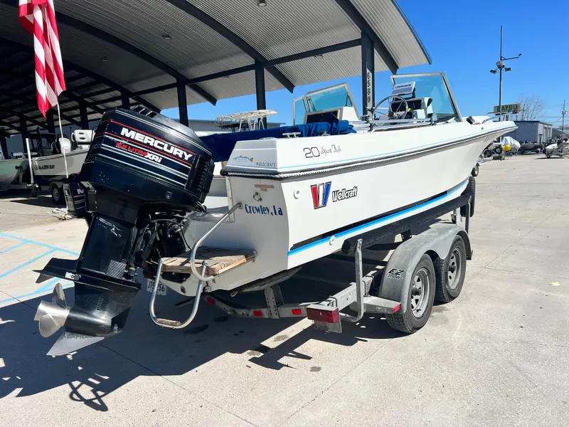Slide: The Image of 1986 Wellcraft V-20 Sport boat on trailer with Mercury engine. - 9
