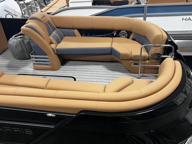 Slide: The Image of 2024 Harris 250 Grand Mariner V10 400 luxury boat interior with tan seating. - 14