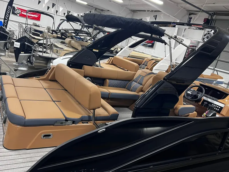Slide: The Image of 2024 Harris 250 Grand Mariner V10 400 luxury pontoon boat interior in showroom. - 19