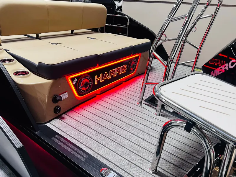 Slide: The Image of 2024 Harris 250 Grand Mariner V10 400 boat interior with illuminated seating and ladder. - 20