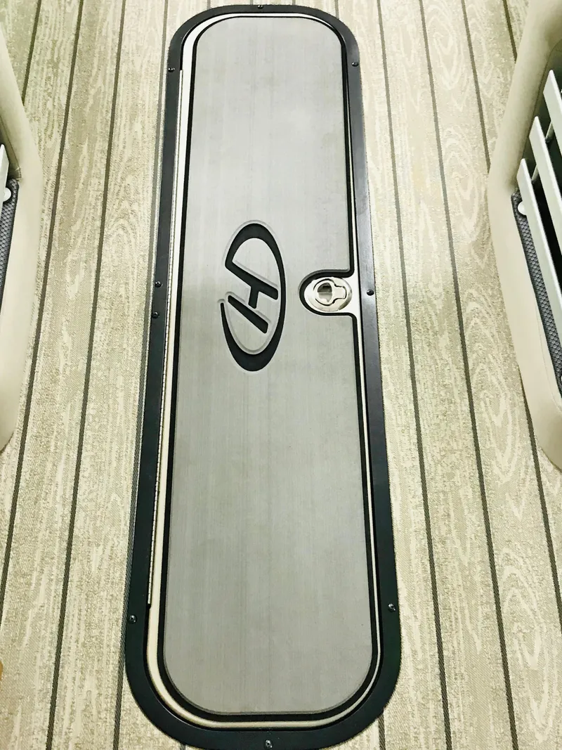 Slide: The Image of 2024 Harris 250 Grand Mariner V10 400 boat storage compartment. - 30