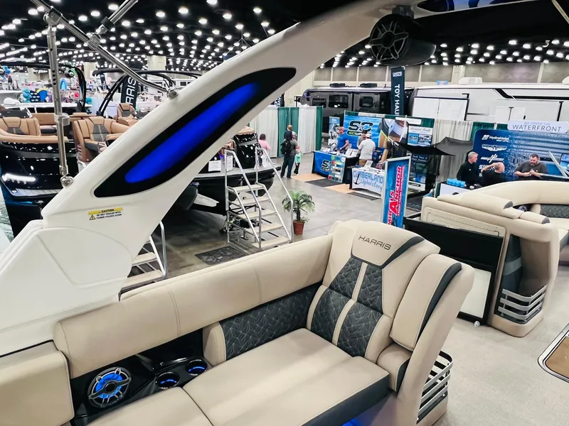 Slide: The Image of 2024 Harris 250 Grand Mariner V10 400 boat interior at a boat show. - 12
