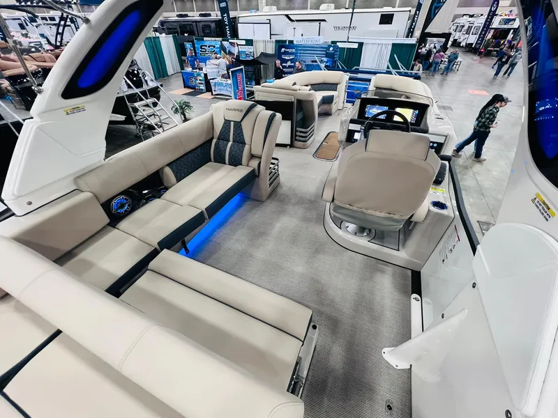 Slide: The Image of 2024 Harris 250 Grand Mariner V10 400 boat interior with luxurious seating and modern design. - 13