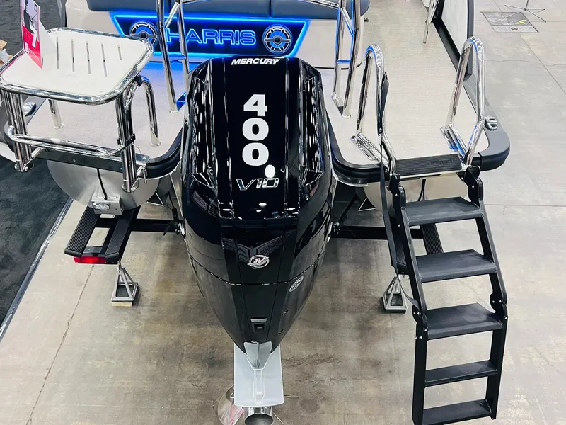 Slide: The Image of 2024 Harris 250 Grand Mariner V10 400 boat with powerful Mercury engine displayed indoors. - 25