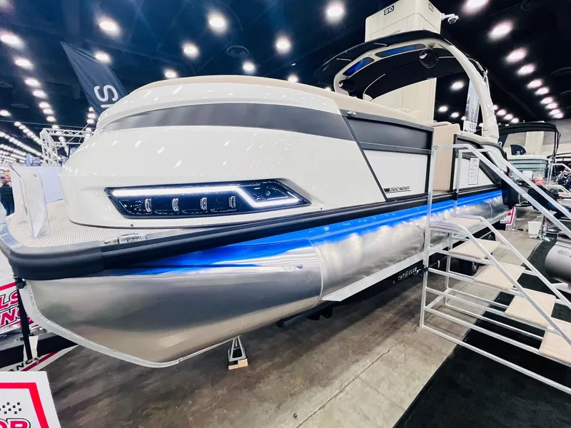 Slide: The Image of 2024 Harris 250 Grand Mariner V10 400 pontoon boat displayed at an indoor exhibition. - 3