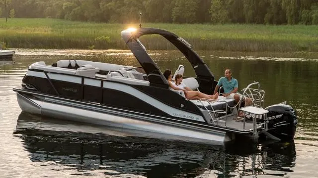 Slide: The Image of 2024 Harris FloteBote 250 Grand Mariner V10 400 cruising on a lake. - 33