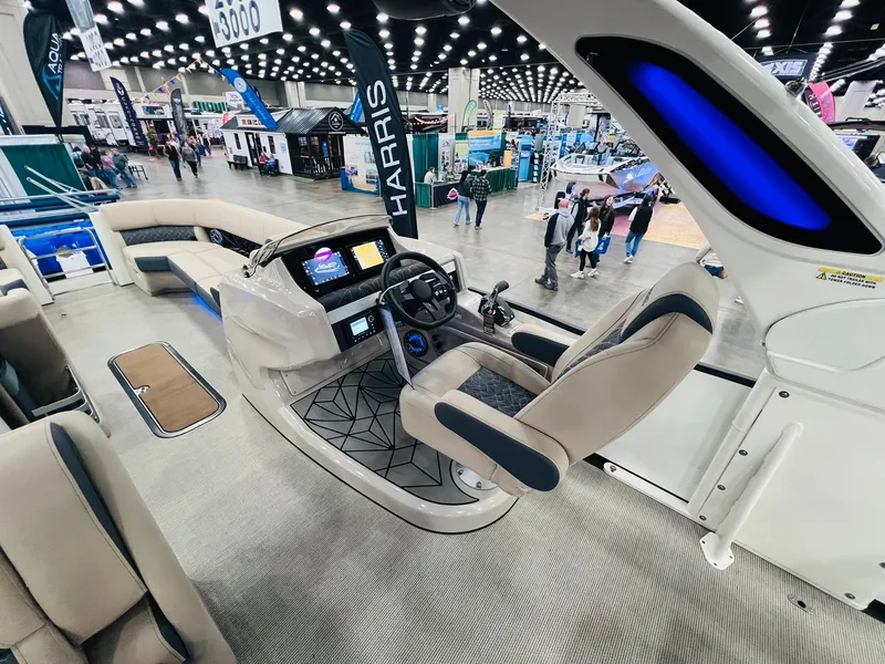 Slide: The Image of 2024 Harris 250 Grand Mariner V10 400 boat interior at a boat show. - 6