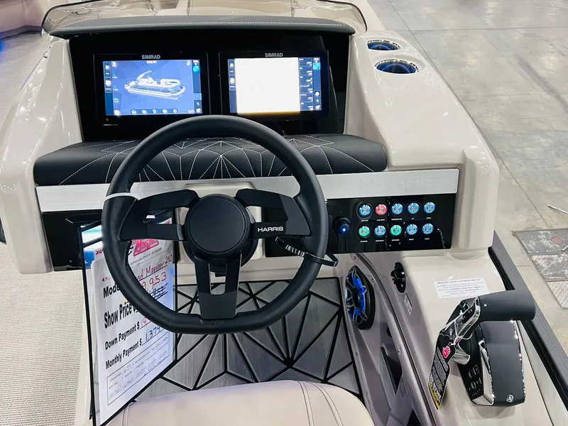 Slide: The Image of 2024 Harris 250 Grand Mariner V10 400 boat dashboard with dual screens and controls. - 7