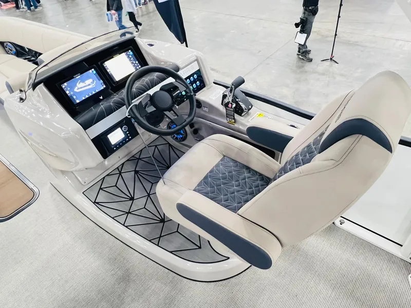 Slide: The Image of 2024 Harris 250 Grand Mariner V10 400 boat interior with modern dashboard and captain's chair. - 8