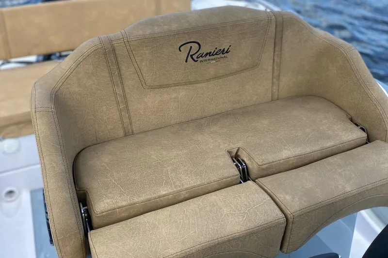 Slide: The Image of 2025 Ranieri Cayman 23.0 Sport Touring boat seat with beige upholstery. - 4