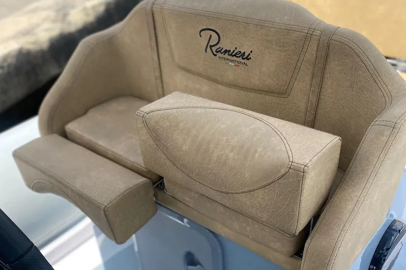 Slide: The Image of 2025 Ranieri Cayman 23.0 Sport Touring beige cushioned seating. - 5