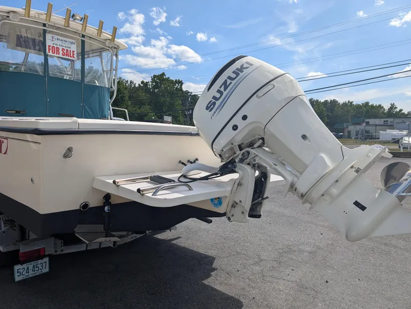 Slide: The Image of 1999 Parker 2510 Walkaround boat with Suzuki outboard motor for sale. - 10