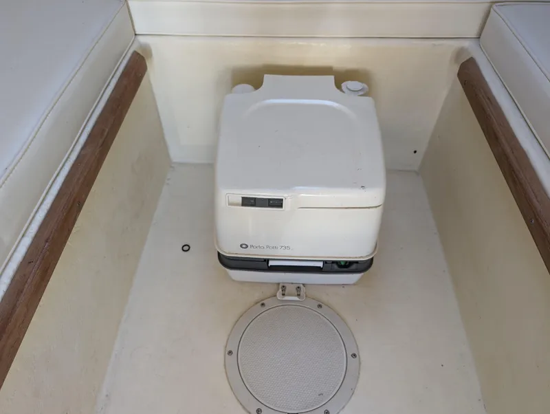Slide: The Image of Portable toilet on a 1999 Parker 2510 Walkaround boat. - 26