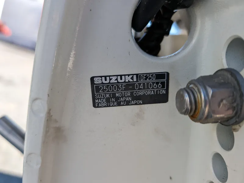 Slide: The Image of Suzuki DF250 engine label on a 1999 Parker 2510 Walkaround boat. - 37