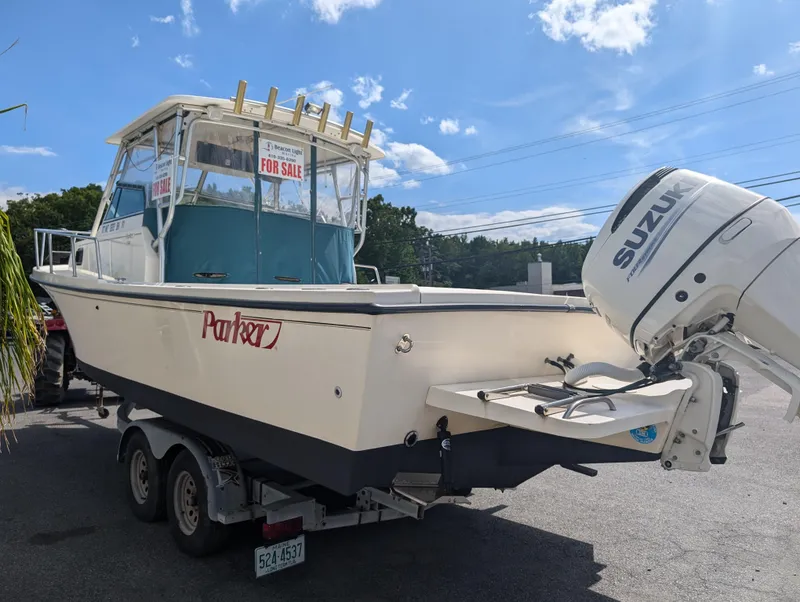 Slide: The Image of 1999 Parker 2510 Walkaround boat for sale with Suzuki outboard motor. - 6