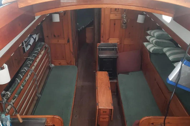 Slide: The Image of Interior of a 1963 Concordia 41 Yawl with wooden furnishings. - 14