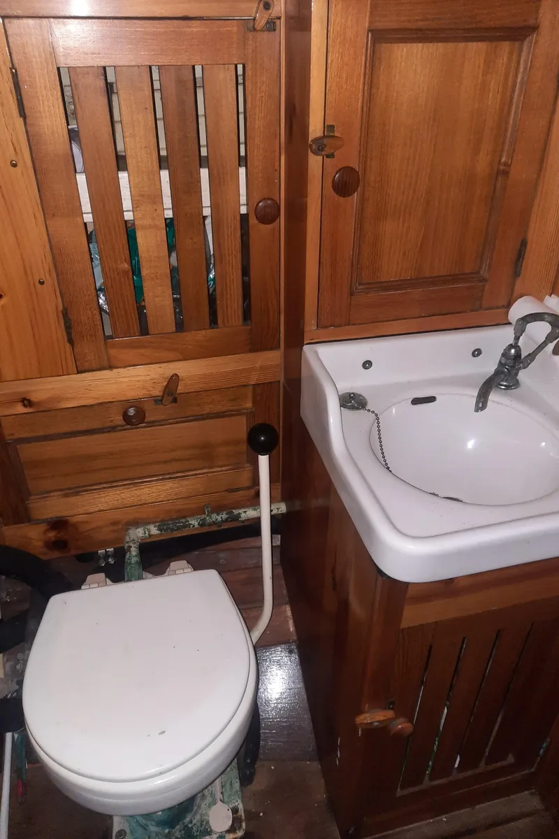 Slide: The Image of Wooden interior in the bathroom of a 1963 Concordia 41 Yawl. - 17