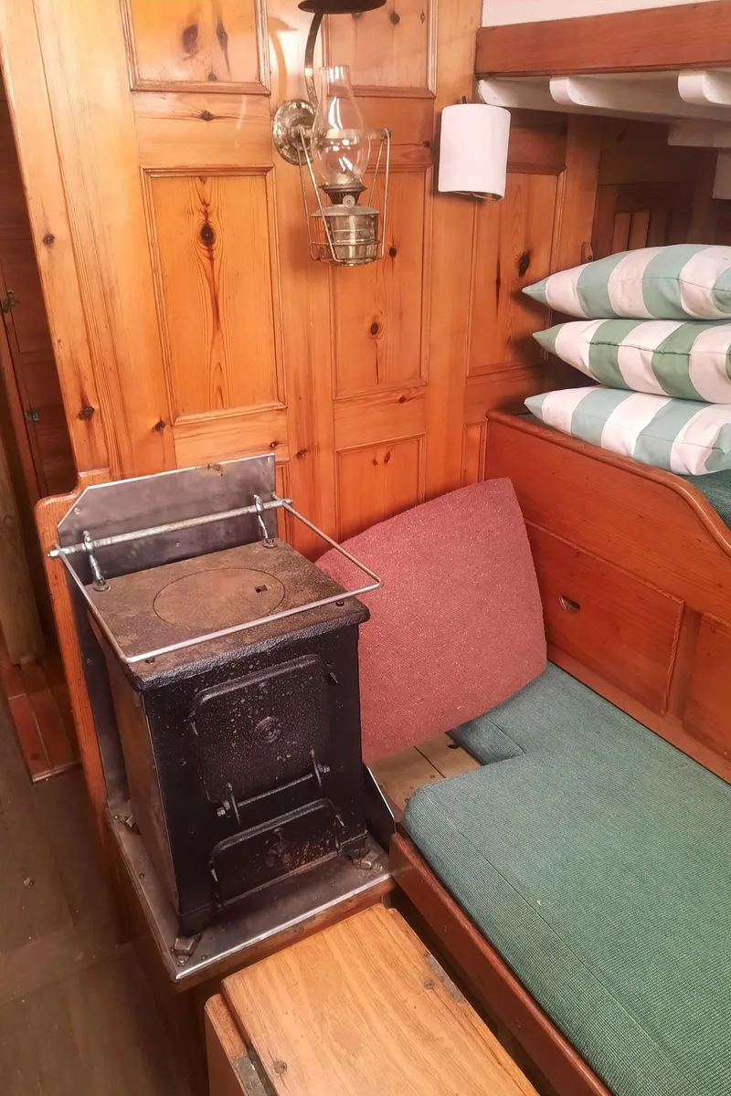 Slide: The Image of Interior of a 1963 Concordia 41 Yawl with wood stove. - 18
