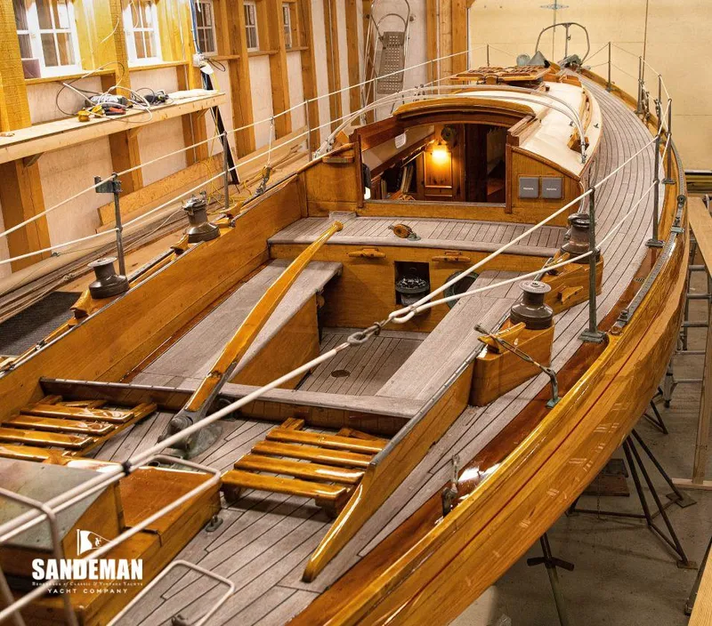 Slide: The Image of 1963 Concordia 41 Yawl in a workshop, wooden deck view. - 4