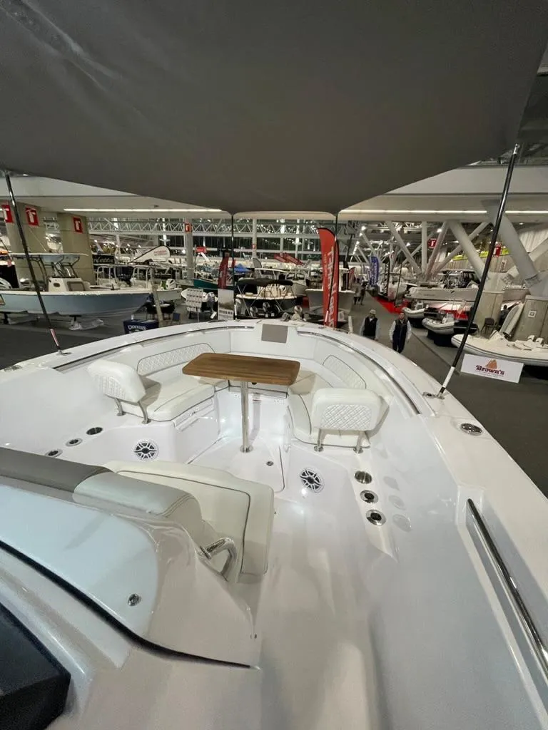 Slide: The Image of 2023 Bertram 28 CC boat interior at a boat show. - 10