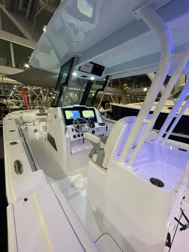 Slide: The Image of 2023 Bertram 28 CC center console boat interior with modern navigation system. - 9