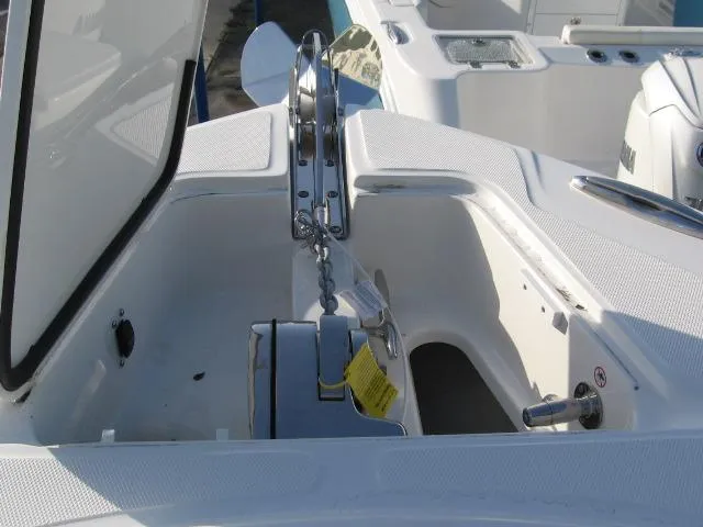Slide: The Image of 2024 Edgewater 325 CC anchor compartment with chain and winch. - 4